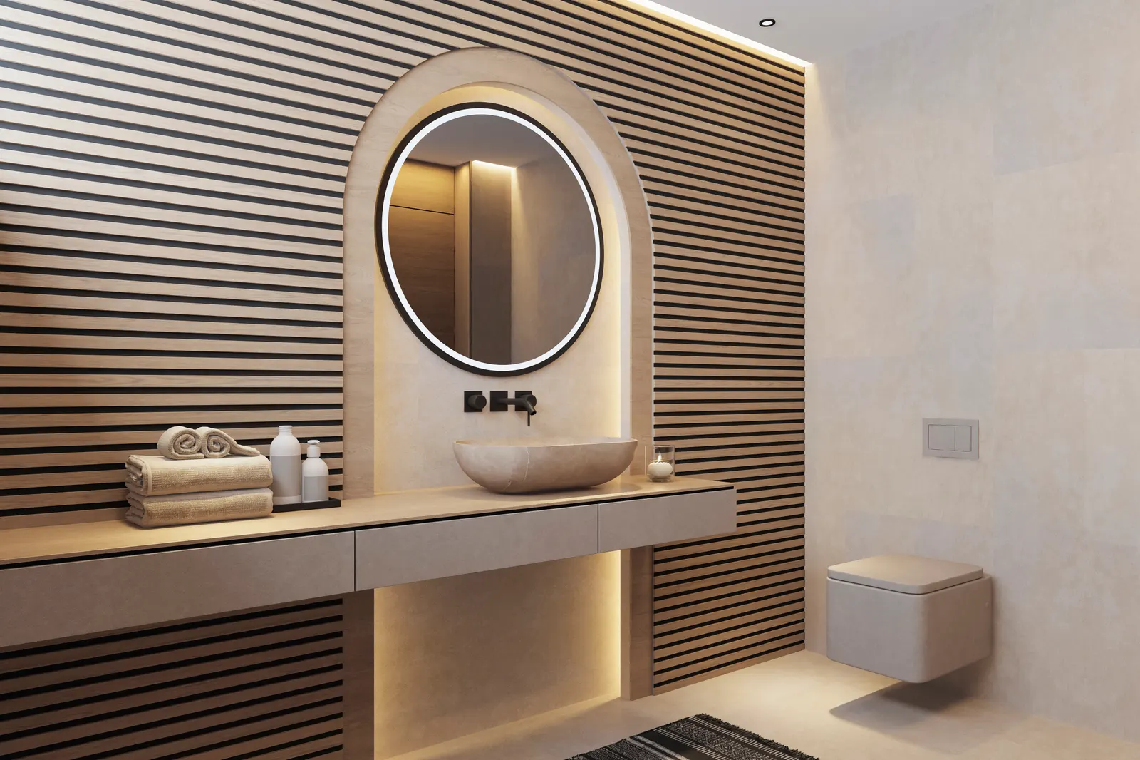 Round backlit mirror set in an arched niche above a stone vessel sink in a wood-slat bathroom.
