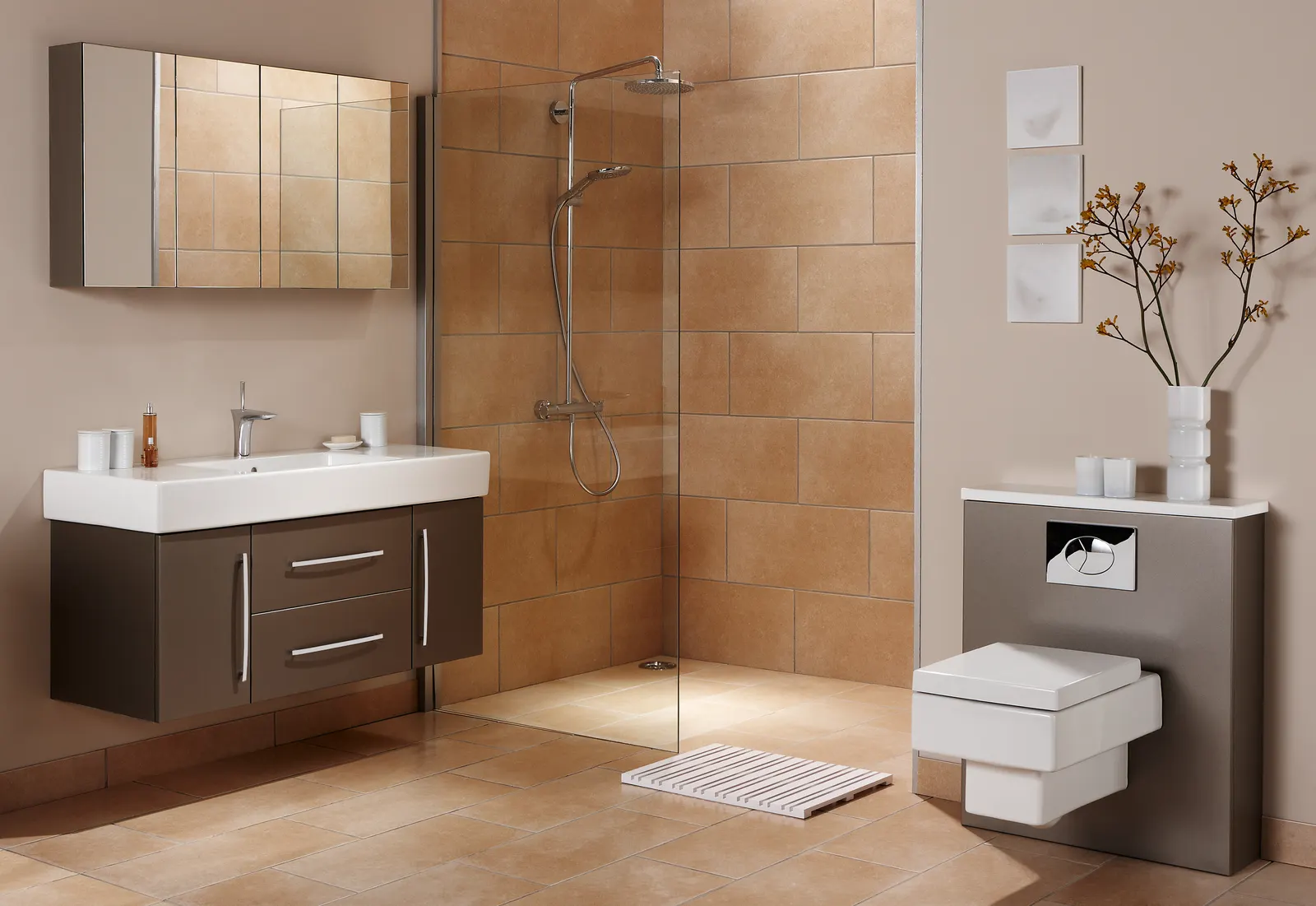 Walk-in wet room with a single clear glass divider panel and warm brown tile.