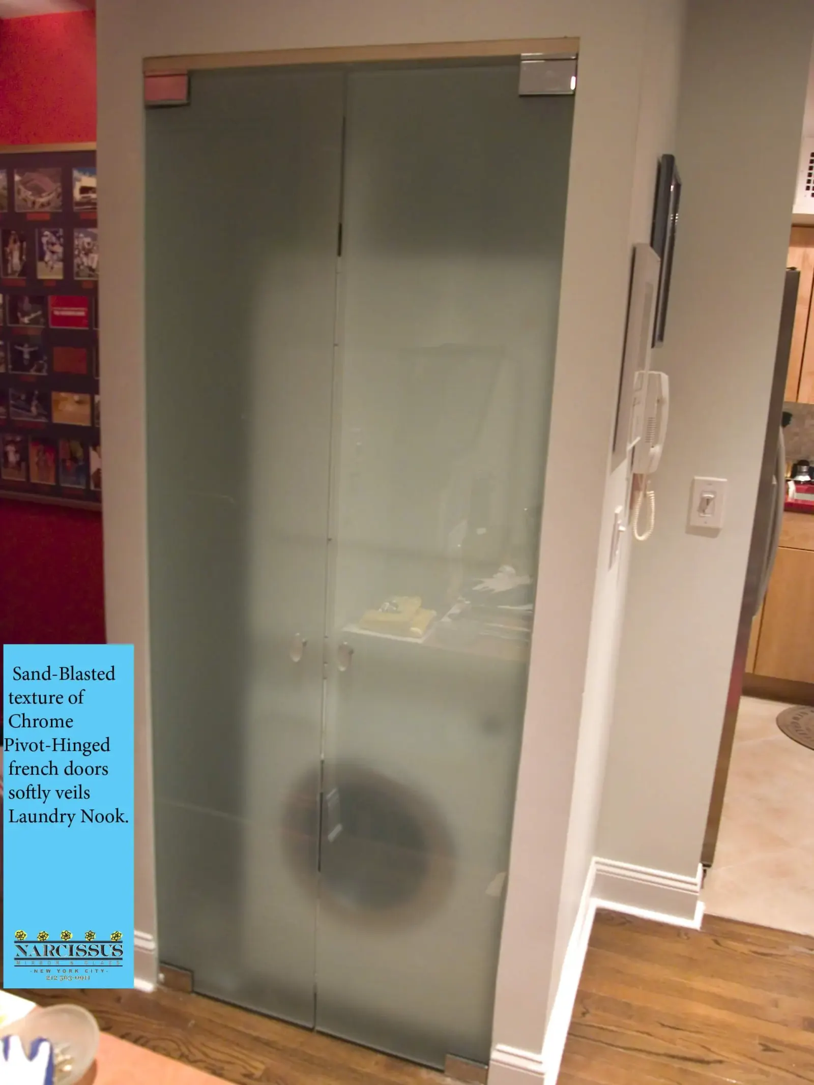 Frosted glass bathroom door with polished metal hardware.